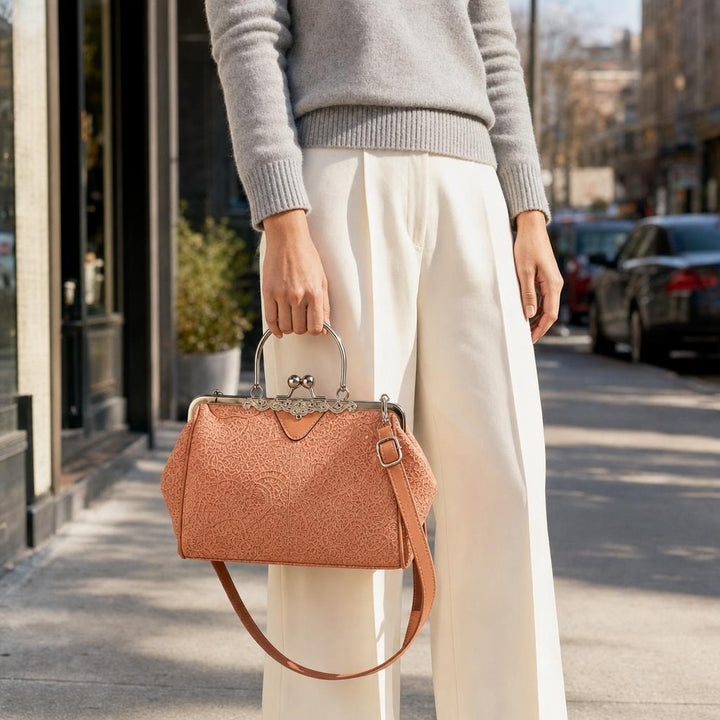 Women's Kiss Lock Crossbody Handbag in Coral, front view